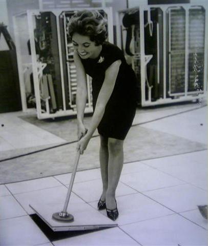 Access Floor Height - Woman Pulling up an Access Floor Panel